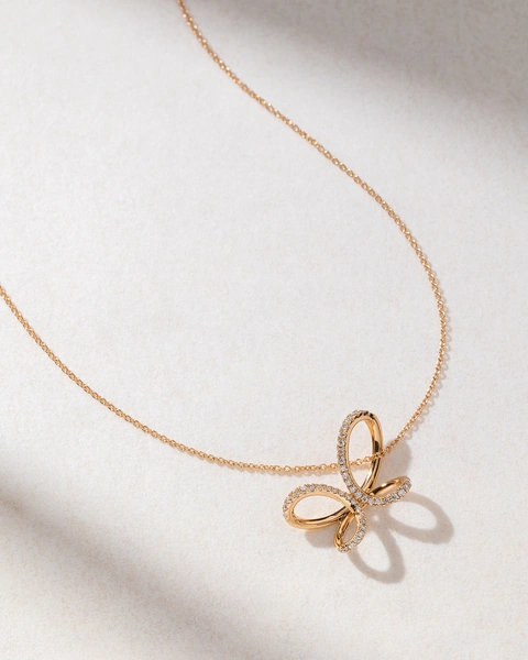 18K Rose Gold Necklace with Diamonds and a Ribbon design