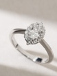 18K White Gold Ring with Central Oval Diamond and Brilliants