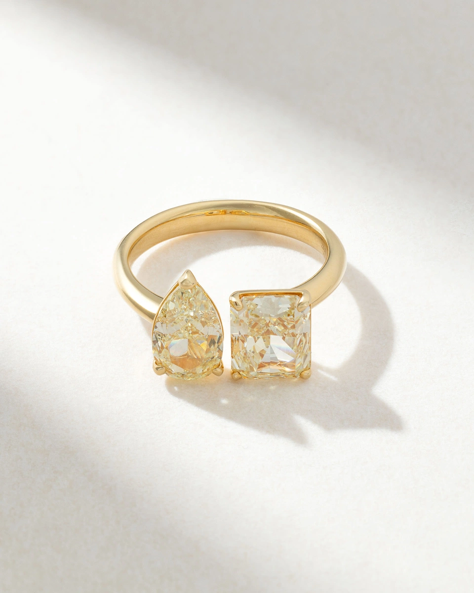 18K Yellow Gold Ring with a Pear Shaped and an Emerald Yellow Diamond