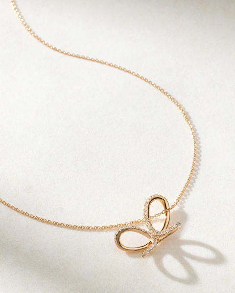 18K Rose Gold Necklace with Diamonds and a Ribbon design