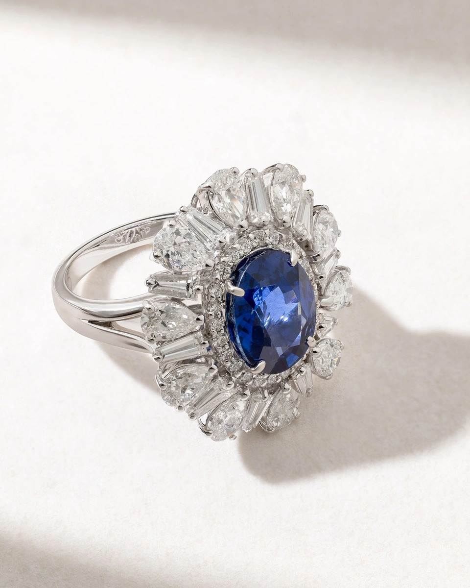 Iconic Oval Sapphire Ring in 18 Karat White Gold with Poir and Tapered Diamonds