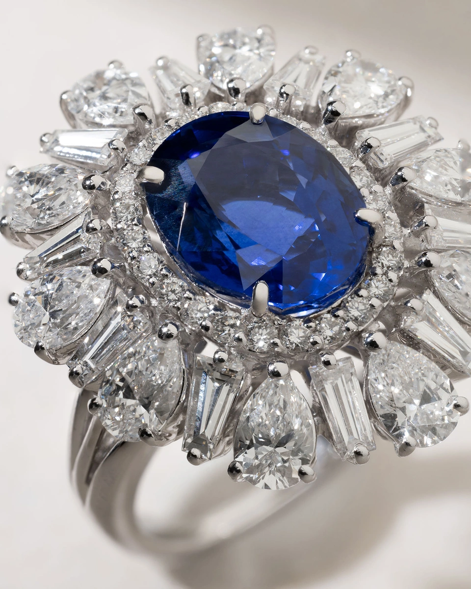 Iconic Oval Sapphire Ring in 18 Karat White Gold with Poir and Tapered Diamonds