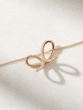 18K Rose Gold Necklace with Diamonds and a Ribbon design - Image 2