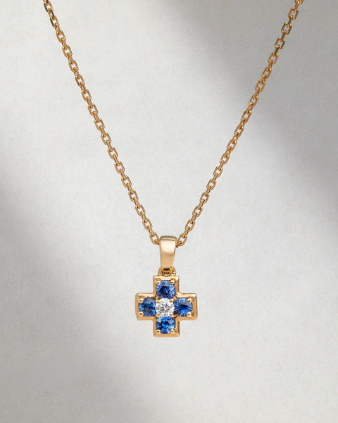 Cross with chain in 18K Rose Gold, featuring a central Brilliant-cut diamond and Sapphires