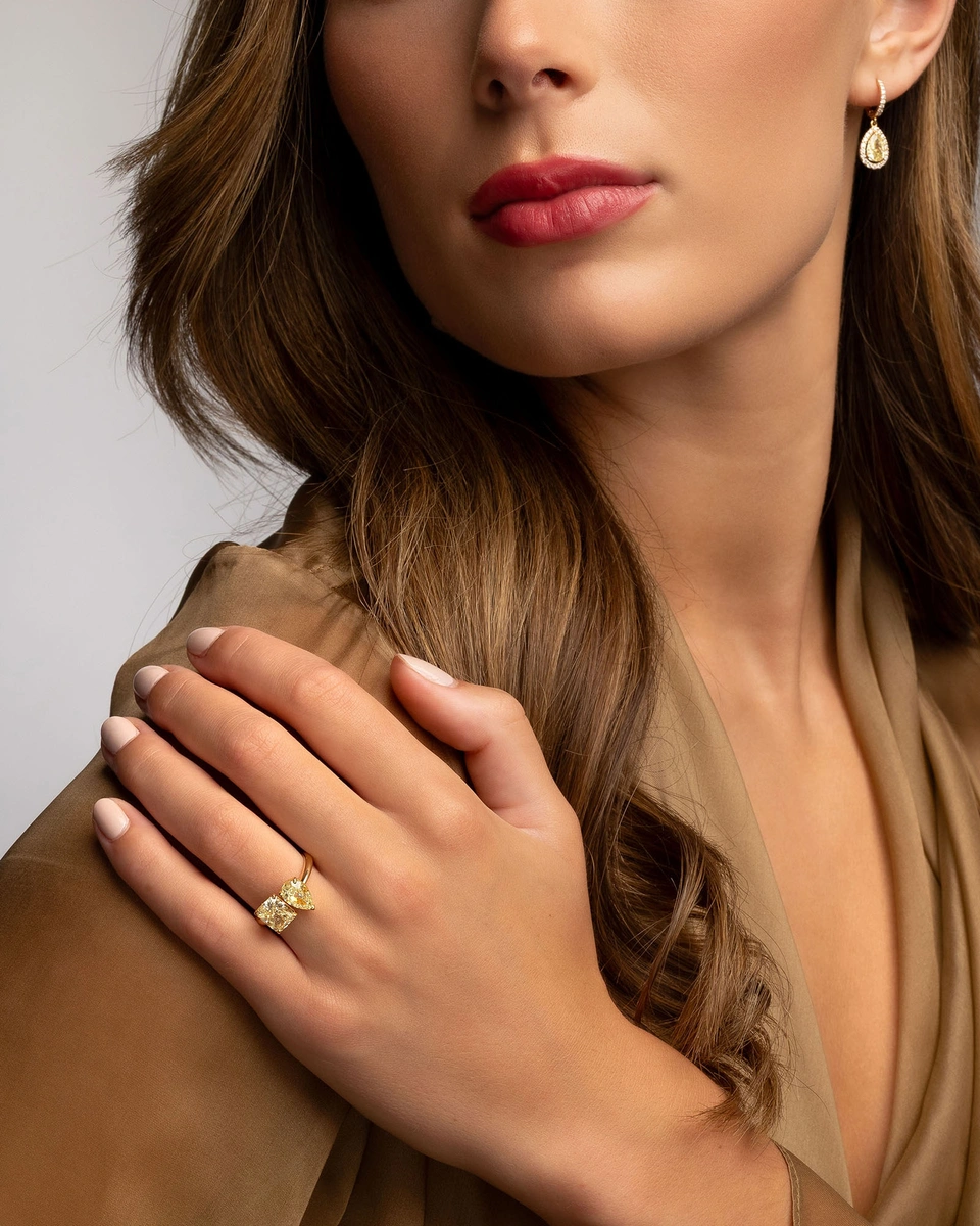 18K Yellow Gold Ring with a Pear Shaped and an Emerald Yellow Diamond