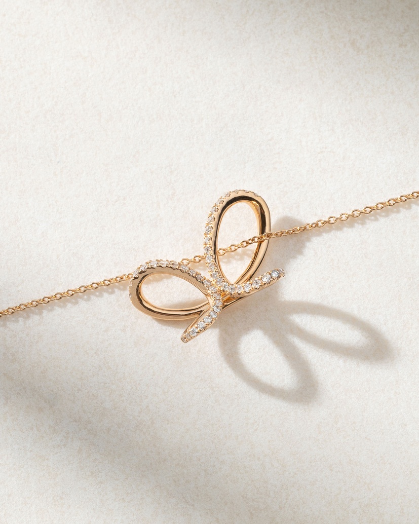 18K Rose Gold Necklace with Diamonds and a Ribbon design - Image 2